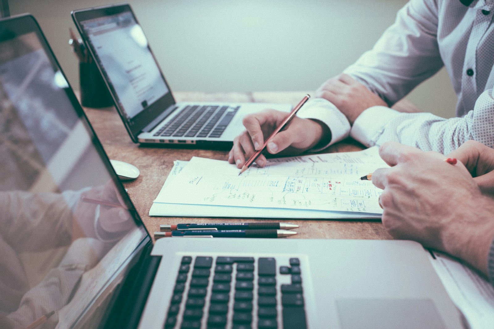 One-to-one desk session reviewing an AI finance workflow